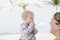 Beautiful Happy Expressive Blond Girl Toddler on the Beach
