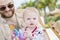 Beautiful Happy Expressive Blond Girl Toddler on the Beach with her Father