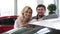Beautiful happy mature couple posing near their new auto holding car keys