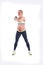 Beautiful happy pregnant women doing exercise with kettlebell on the white background
