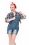 Beautiful happy retro woman in plaid shirt and bib overalls