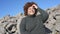 Beautiful happy smiling plus size African black woman afro hair in grey sweater outdoor enjoying bright sunny weather