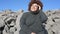 Beautiful happy smiling plus size African black woman afro hair in grey sweater outdoor enjoying bright sunny weather