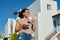 Beautiful happy smiling woman walking with cup of coffee