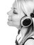 Beautiful happy teenage girl listens to music through the headphones