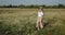 Beautiful happy Woman in Chamomile field