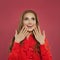 Beautiful happy woman looking up on colorful bright pink background. Perfect girl laughing portrait. Positive emotion