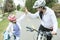 Beautiful and happy young on bicycle with her