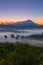 Beautiful harmony romantic color sunrise landscape scenery with sunlight and fog and Mount Kinabalu