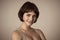 Beautiful headshot portrait of young attractive woman with stylish short hair and sensual look