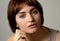 Beautiful headshot portrait of young attractive woman with stylish short hair and sensual look