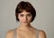 Beautiful headshot portrait of young attractive woman with stylish short hair and sensual look