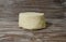 Beautiful, healthy and tasty feta cheese on a beautiful textured wooden background