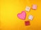 Beautiful hearts in gift box on yellow golden background. Valentines day concept flat lay