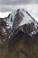 Beautiful high mountain with rocks, snowfields, glaciers and rocky scree