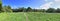 Beautiful high resolution summer landscape with fields, green grass and a stunning summer sky taken in northern germany