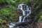 Beautiful high waterfall deep in the Carpathian mountains