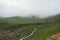 A beautiful hill, brook and clouds.