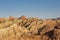 Beautiful hilly landscape and bus through winding road in zhangye