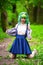 Beautiful hipster alternative young woman with green hair in park