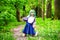 Beautiful hipster alternative young woman with green hair in park