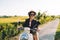 Beautiful hipster girl testing vintage moped during journey