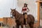 A Beautiful Hispanic Brunette Model Rides A Horse On A Mexican Farm