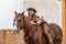 A Beautiful Hispanic Brunette Model Rides A Horse On A Mexican Farm
