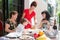 Beautiful hispanic family enjoying an outdoor home meal together