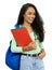 Beautiful hispanic student with dental aligner and books and backpack