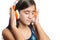 Beautiful hispanic teenage girl enjoying music on bright orange headphones