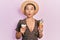 Beautiful hispanic woman with short hair eating ice cream cones making fish face with mouth and squinting eyes, crazy and comical
