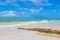 Beautiful Holbox island beach sandbank boulders turquoise water waves Mexico