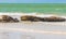 Beautiful Holbox island beach sandbank boulders turquoise water waves Mexico