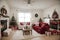 Beautiful holdiay decorated room with Christmas tree with presents under it