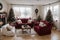 Beautiful holdiay decorated room with Christmas tree with presents under it