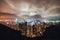 Beautiful Hong Kong island cityscape, aerial night view from Victoria Peak in cloudy storm weather