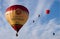 Beautiful hot air balloons raising to the blue sky during a festival in United Kingdom
