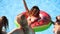 Beautiful hot pretty girls in bikini have pool party dancing with inflatable watermelon floaty mattress. Glamour fitted