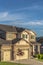 Beautiful house exterior with concrete and stone brick wall against blue sky