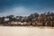 Beautiful houses and beaches on the banks of Elbe river in Hamburg on a cold end of winter day