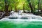 Beautiful Huay Mae Khamin waterfall in tropical rainforest at Sr