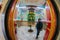 Beautiful huge bhuddhist prayer wheel in an ornately decorated room shot with a fisheye lens