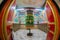 Beautiful huge bhuddhist prayer wheel in an ornately decorated room shot with a fisheye lens