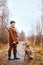 beautiful hunting dog with owner during a hunting day. Autumn season, hunter. outdoors
