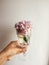 Beautiful Hydrangea colorful bouquet in wine glass with water, r