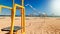 Beautiful iamge of empty volleyball field on the sea beach at bright sunny windy day. Sports on summer holiday vacation