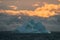 Beautiful iceberg floating in the water. Photo taken at sunset in Antarctica and Arctic Greenland. Global warming and