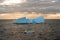 Beautiful iceberg floating in the water. Photo taken at sunset in Antarctica and Arctic Greenland. Global warming and