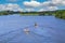 Beautiful idyllic dutch lakescape, 2 motor sport boats, green forest, ,blue summer sky - Leukermeer, Netherlands